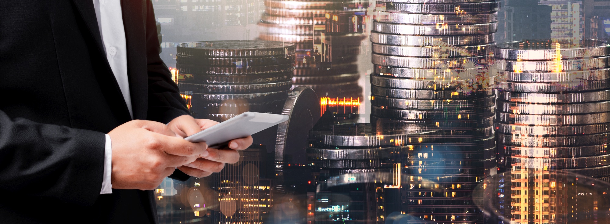 Double exposure of city and rows of coins for finance and busine Double exposure of city and rows of coins for finance and busine